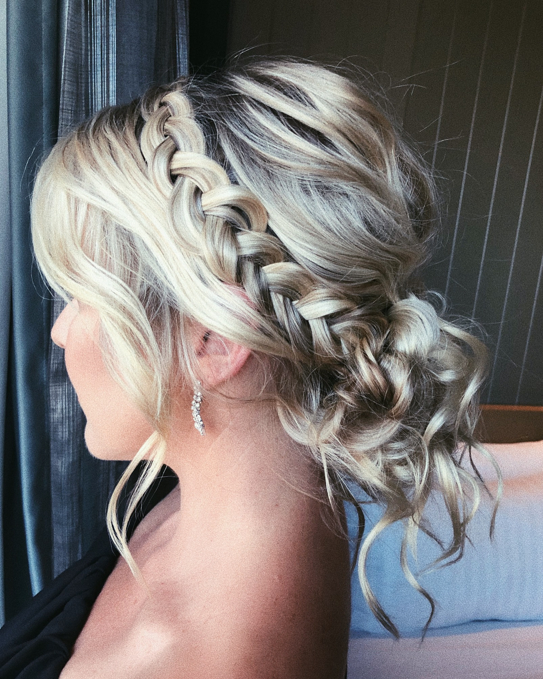 11-messy-braid-into-bun A long, textured braid that wraps into a messy bun at the nape of the neck.