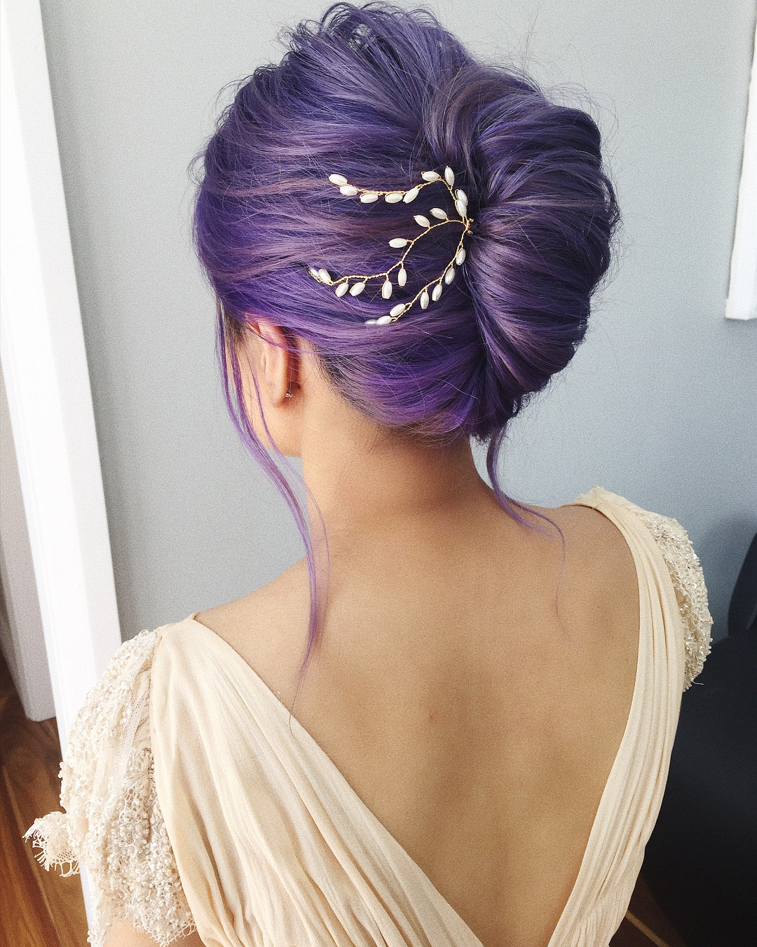 13-french-twist A classic French twist updo with a beautiful accessory on the side.