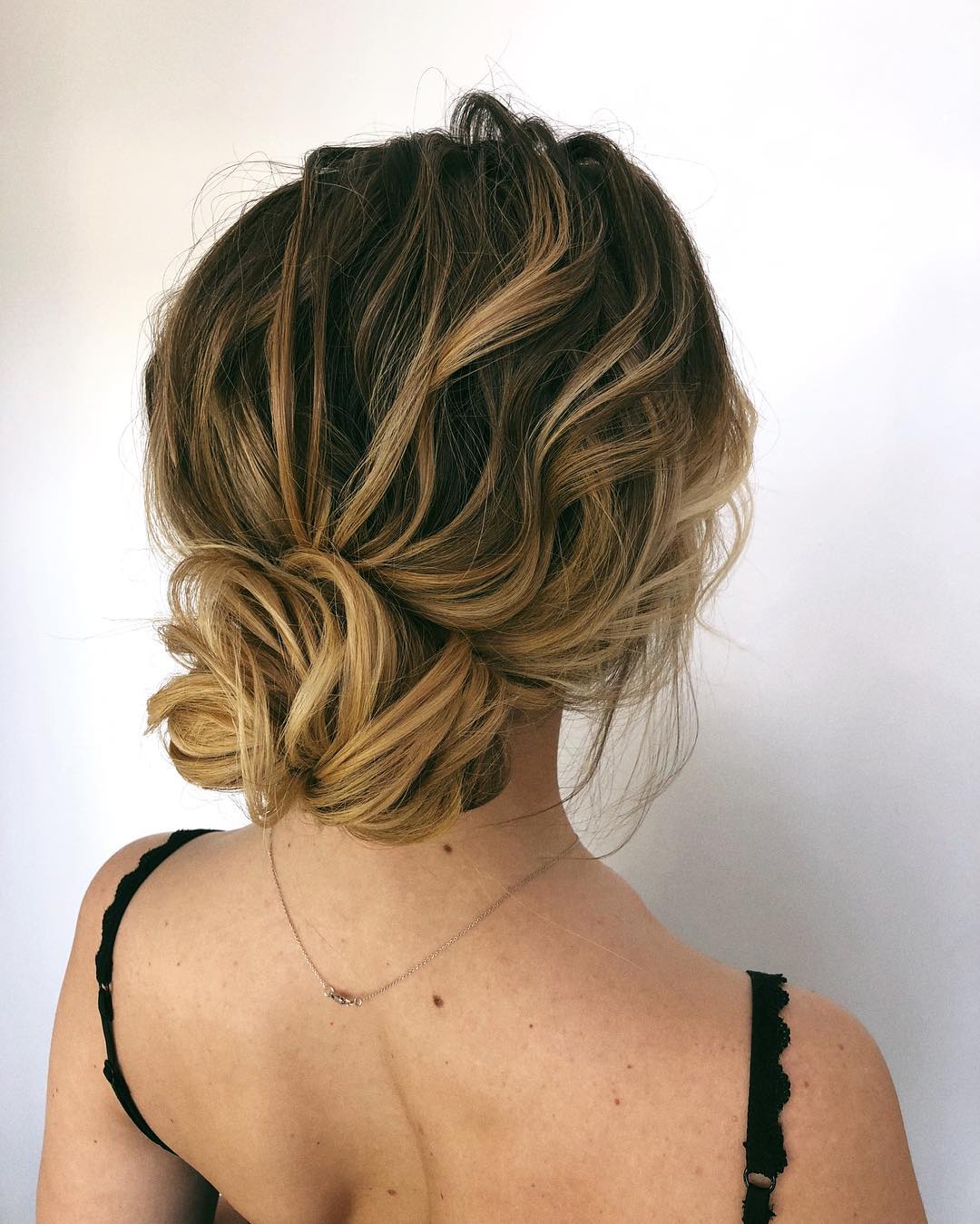 15-textured-bun A gorgeous bun created with wavy, textured hair.