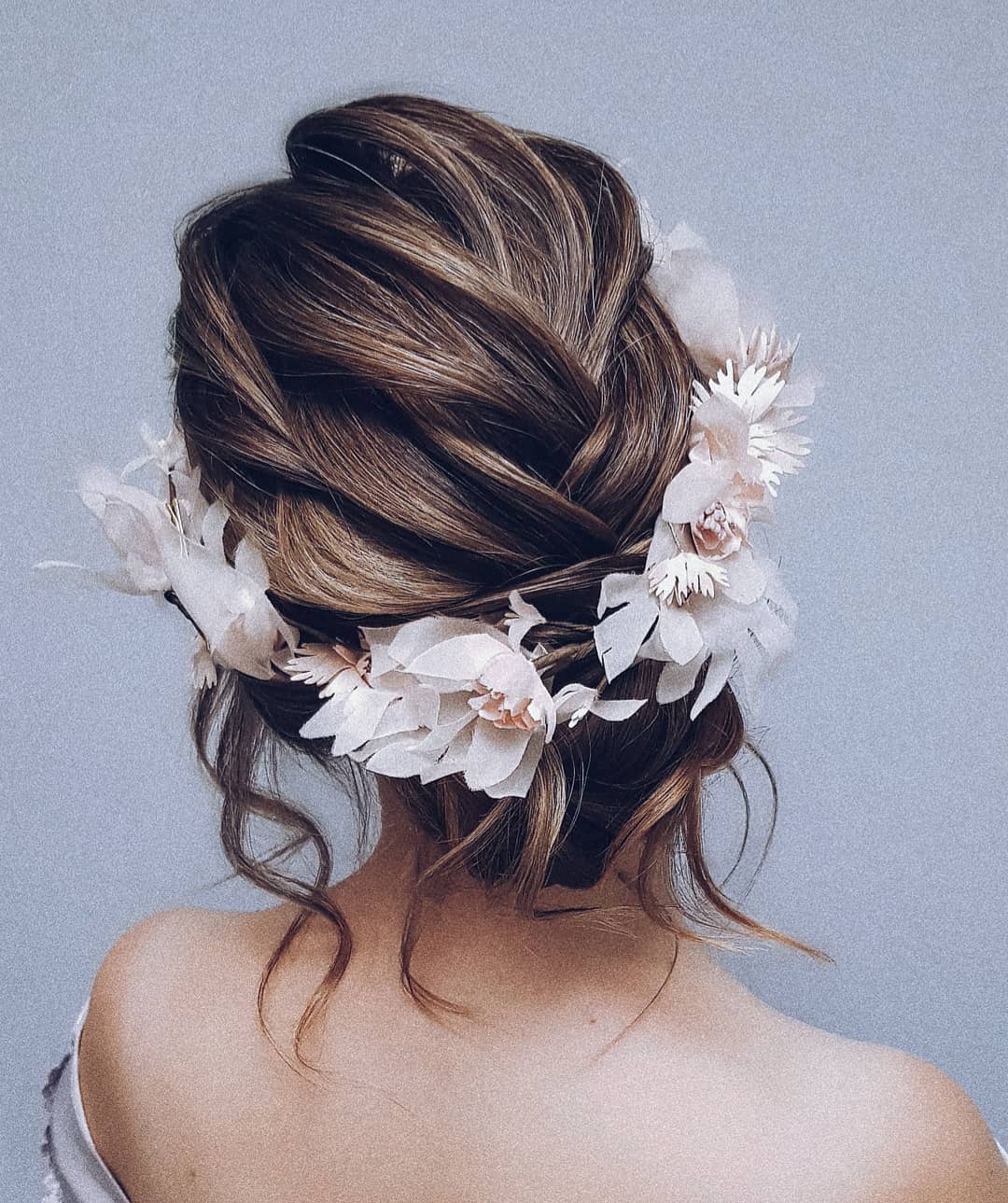 19-flower-crown A loose updo topped with a beautiful, lush flower crown.