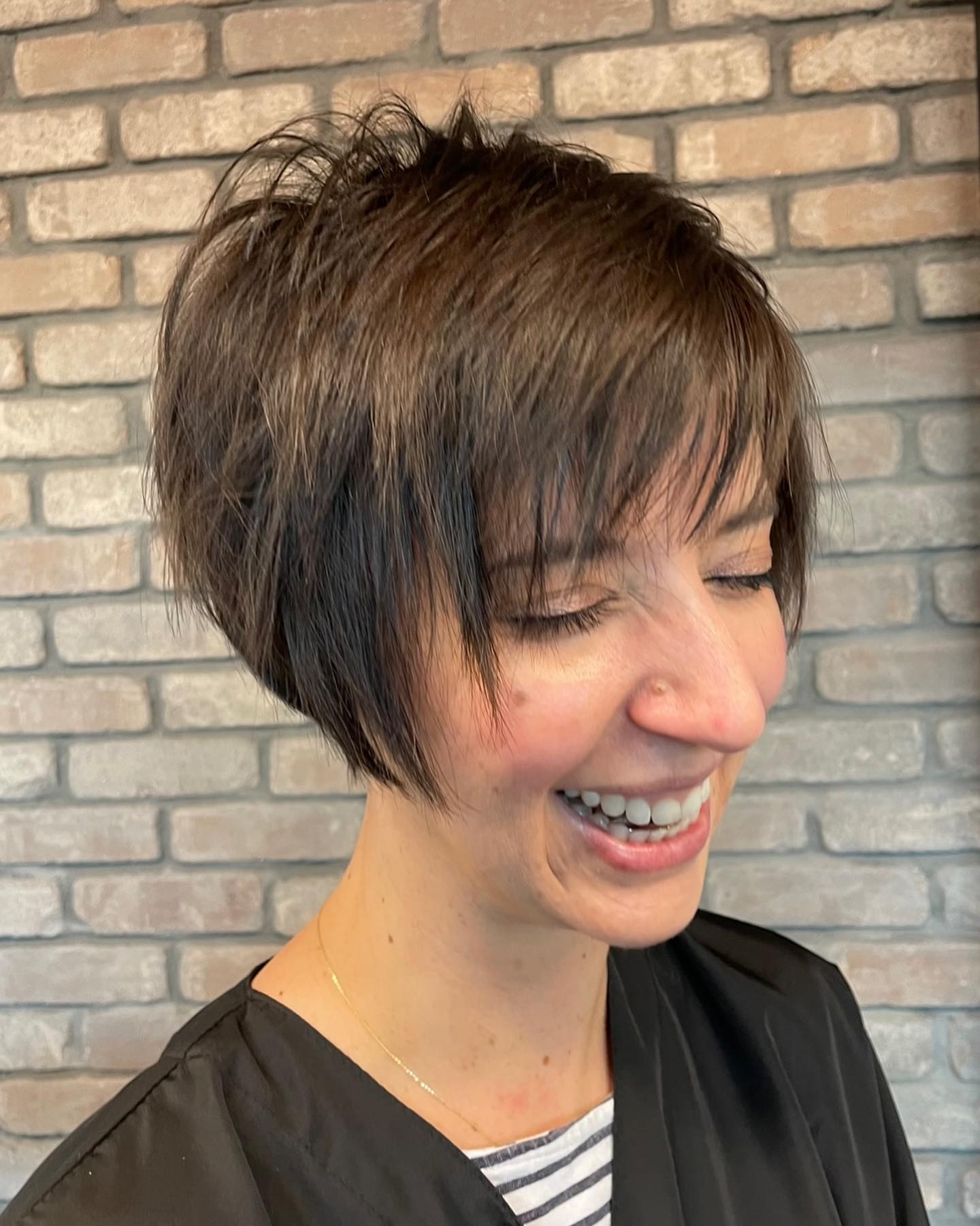 Long brown bixie with wispy bangs