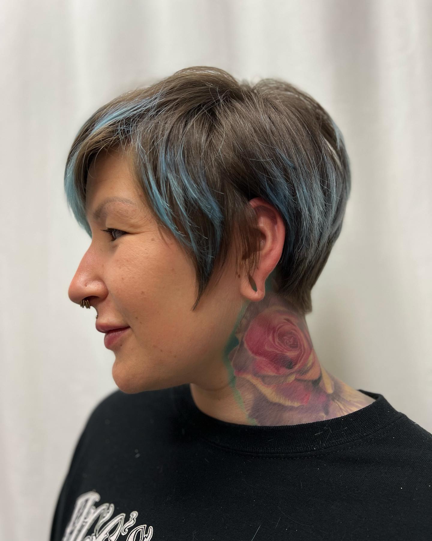 Bixie haircut with brown base and blue highlights