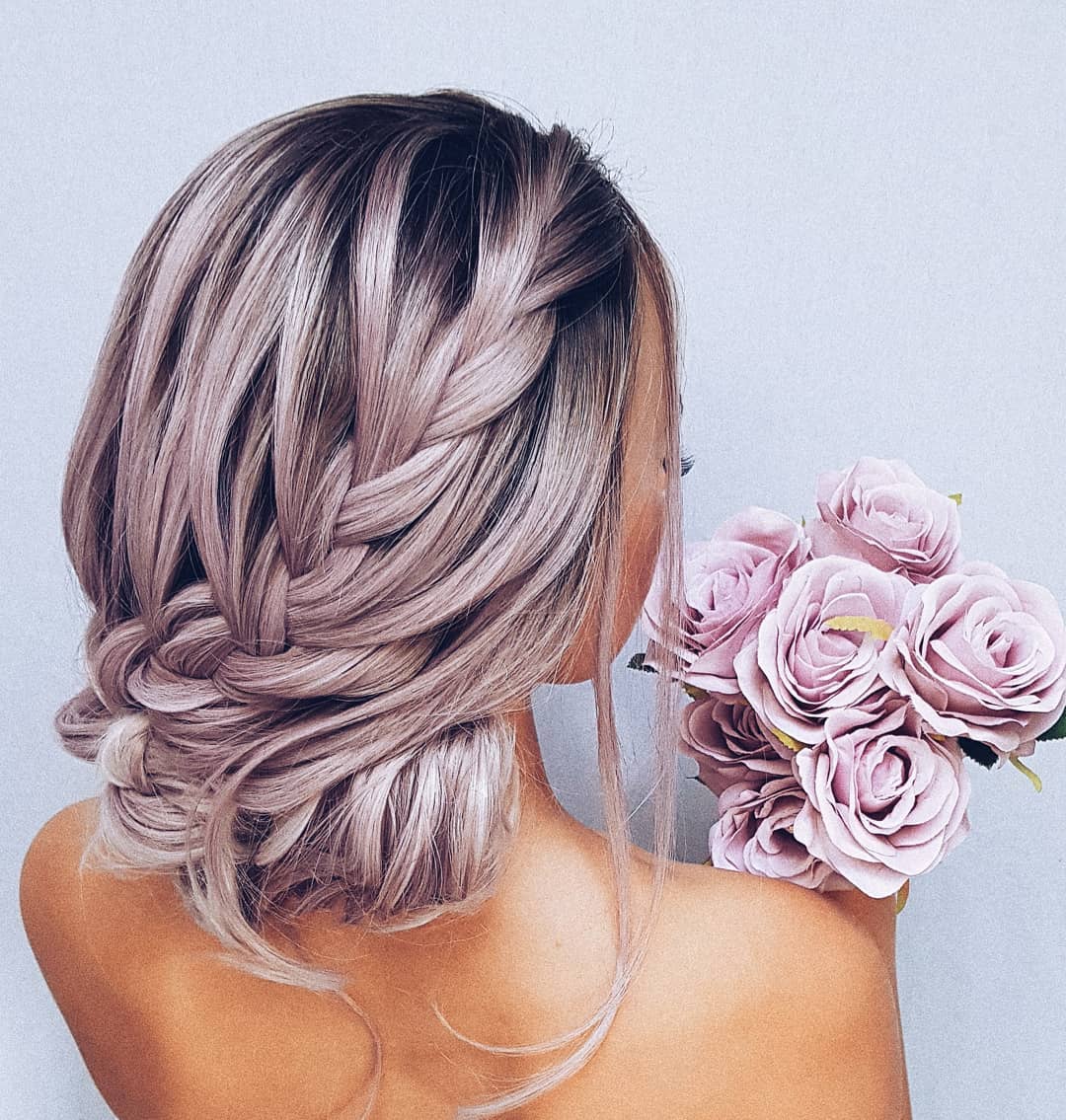 29-loose-braid-in-bun A super loose braid twisted into a low bun for a romantic look.