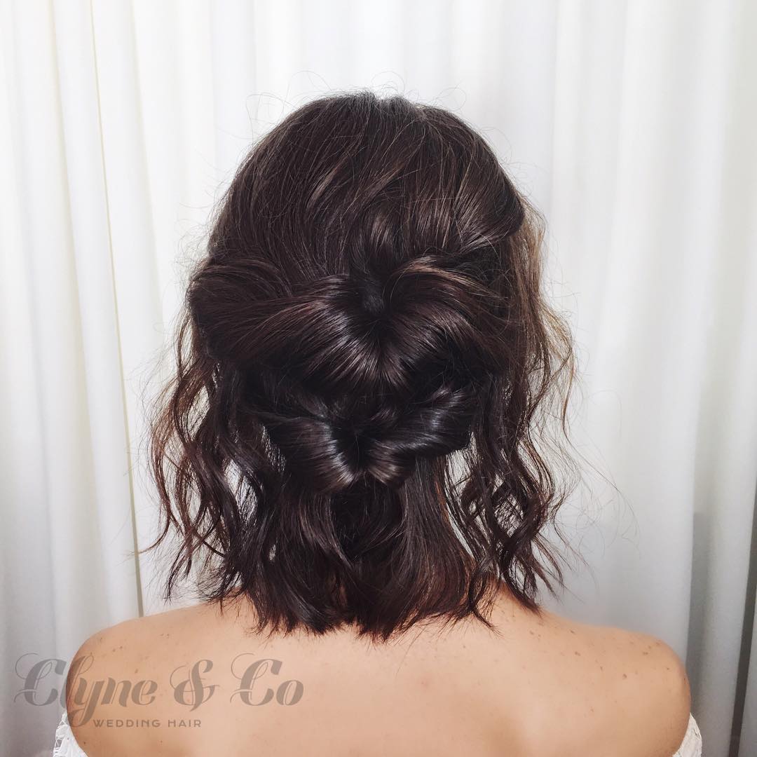 34-heart A half-up style where the hair is shaped into a heart, with loose waves below.