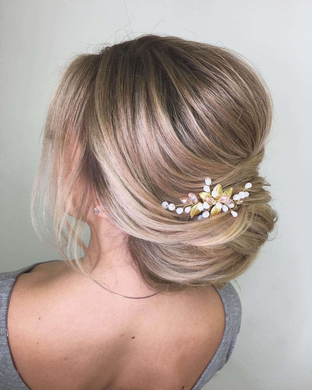 39-low-twist An elegant low twist updo, paired with a small, delicate hair accessory.