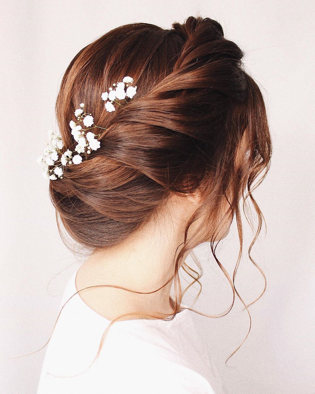 8-twisted-halo-braid A twisted halo braid forming a crown around the head.