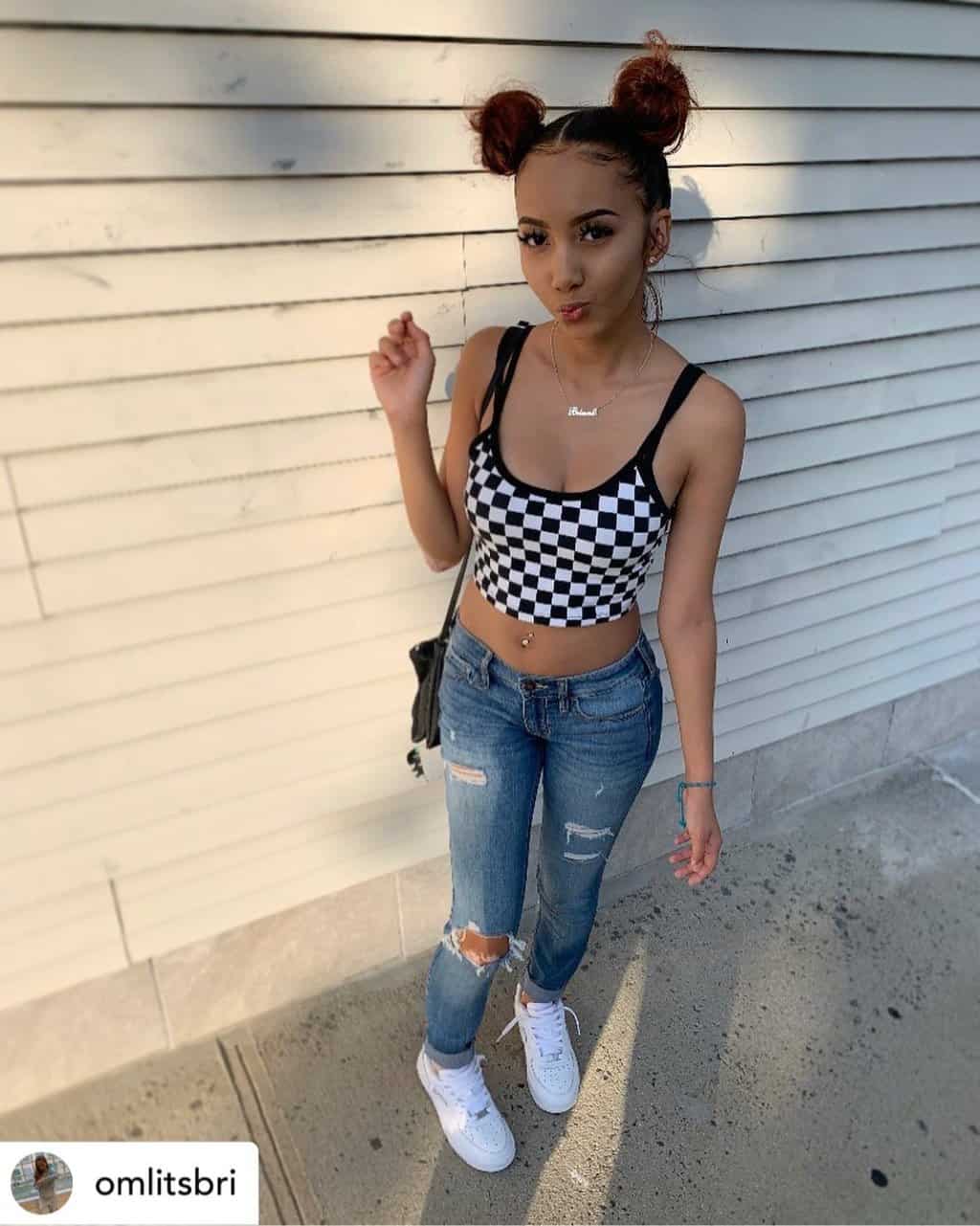 Instagram baddie with space buns.