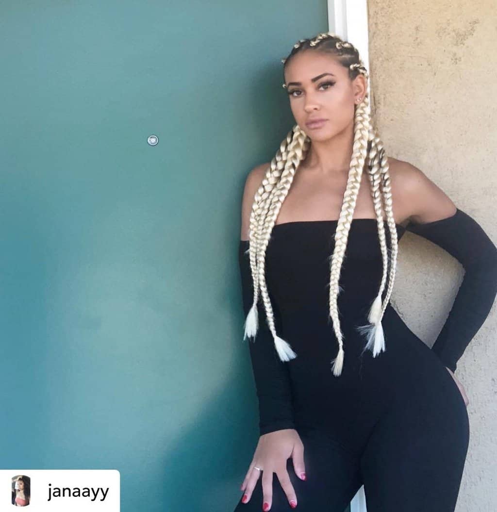 Instagram baddie with blonde cornrows.