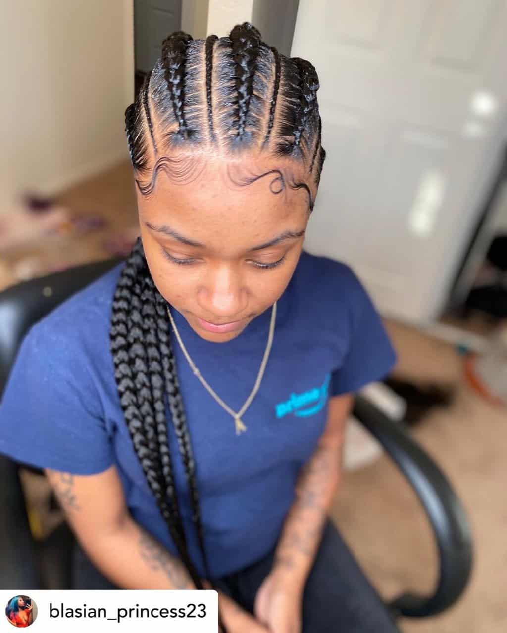 Instagram baddie with slayed edges and cornrows.