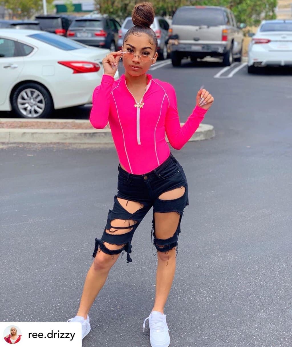 Instagram baddie with an Ultra-High Topknot.