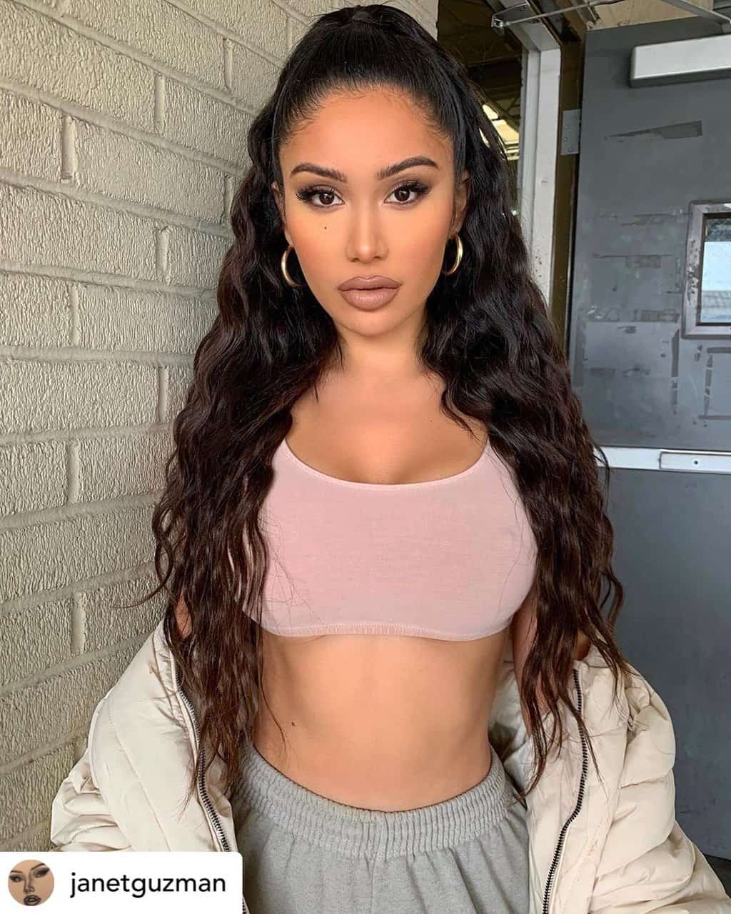 Instagram baddie with a half-up high ponytail.