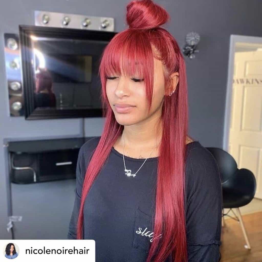 Instagram baddie with sleek half-up topknot.