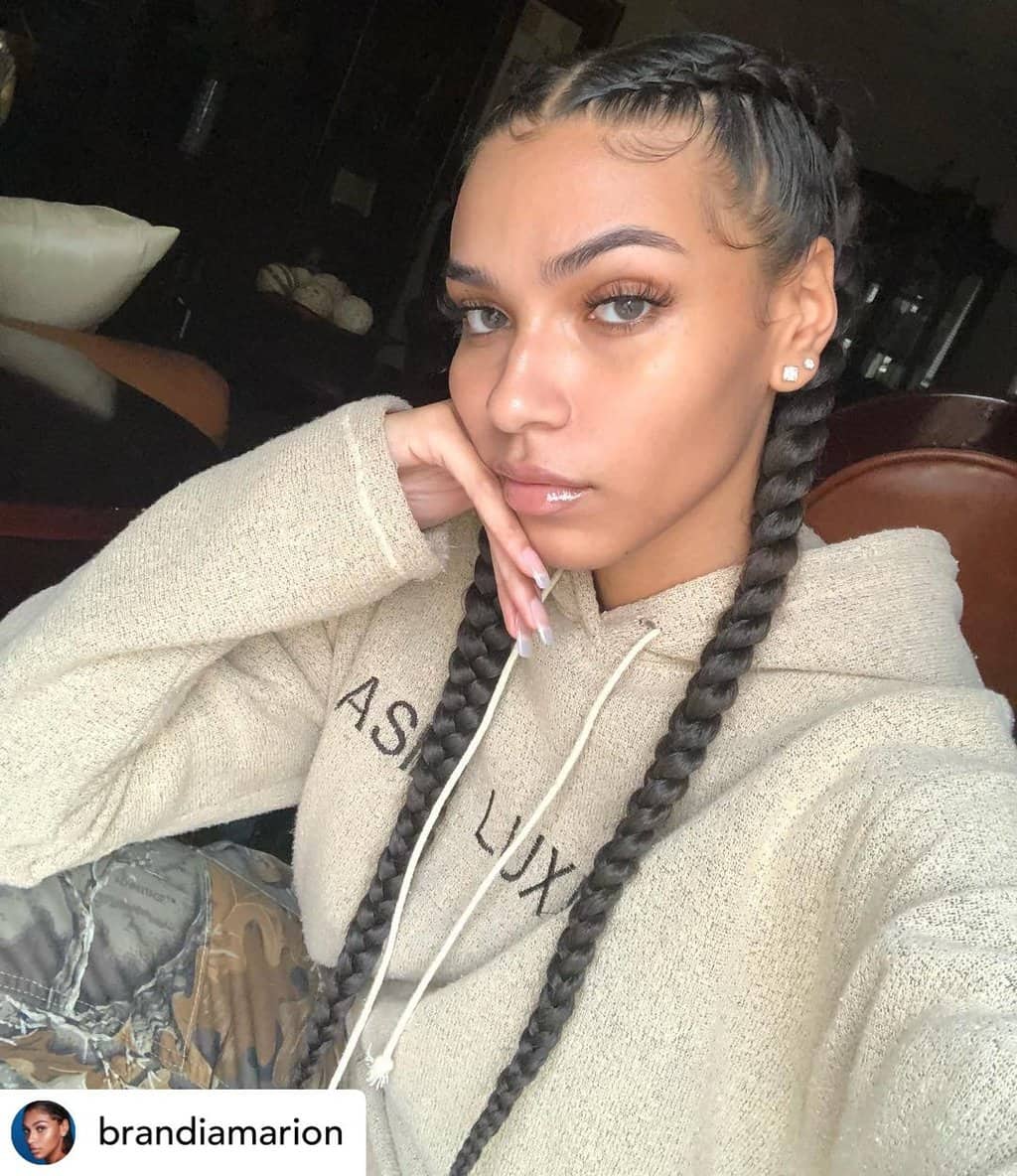 Instagram baddie with boxer braids.