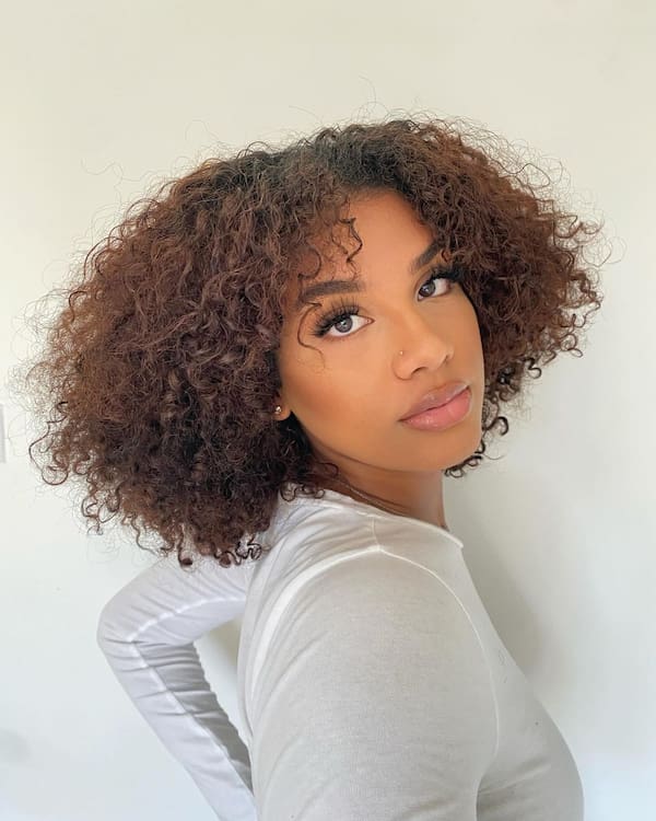 blow-out-curly-hair-with-bangs Blow Out Curly Hair with Bangs