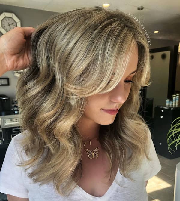 Classic Ashy Blonde Haircut with Feathered Bangs