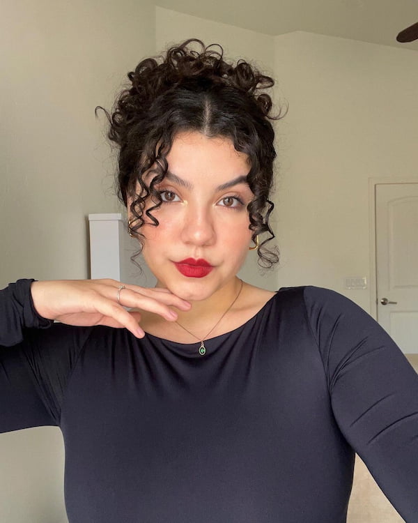 curly-messy-bun-with-tendrils Curly Messy Bun with Tendrils