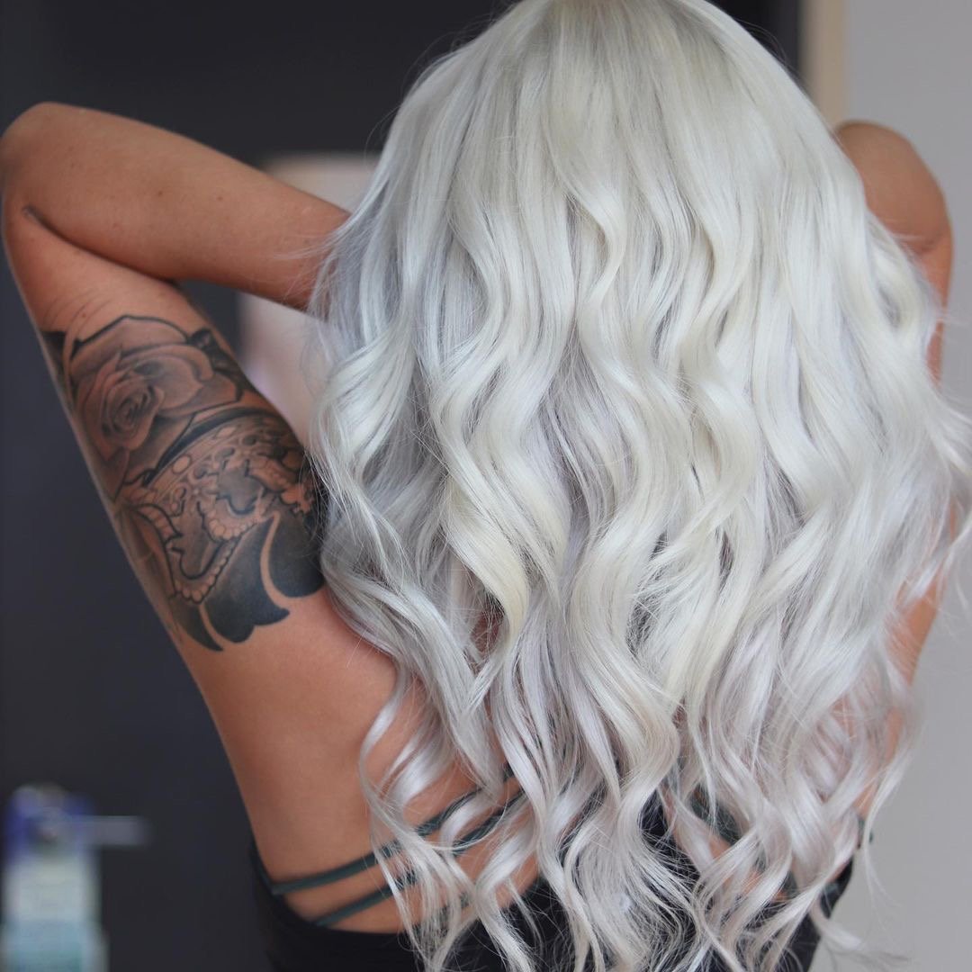Gorgeous icy platinum hair on long wavy hair.