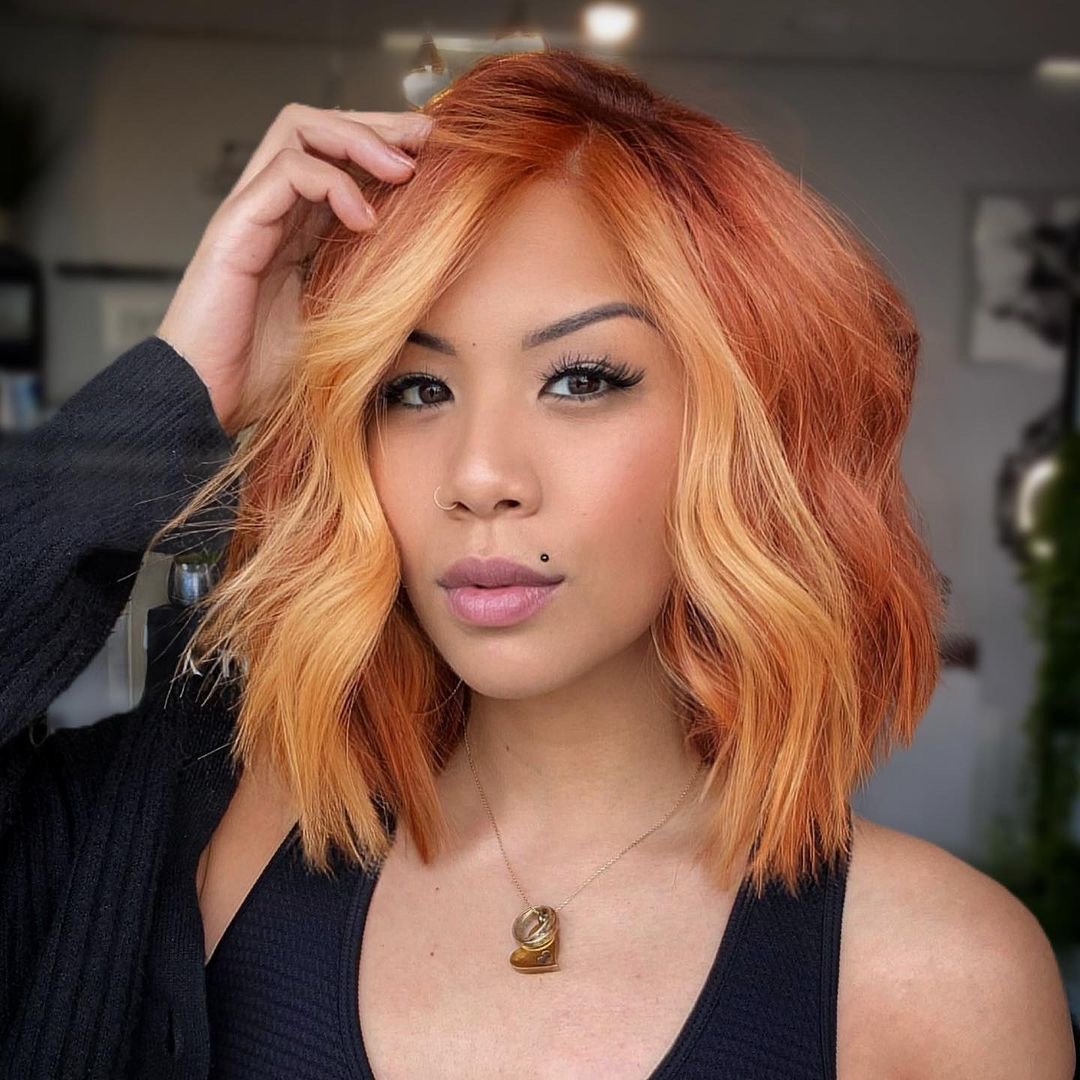 Beautiful copper hair color on short wavy bob.