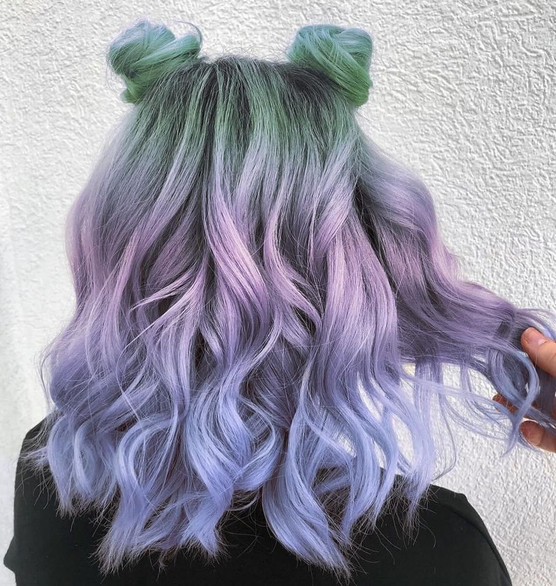 Beautiful pastel hair color on mid-length wavy hair.