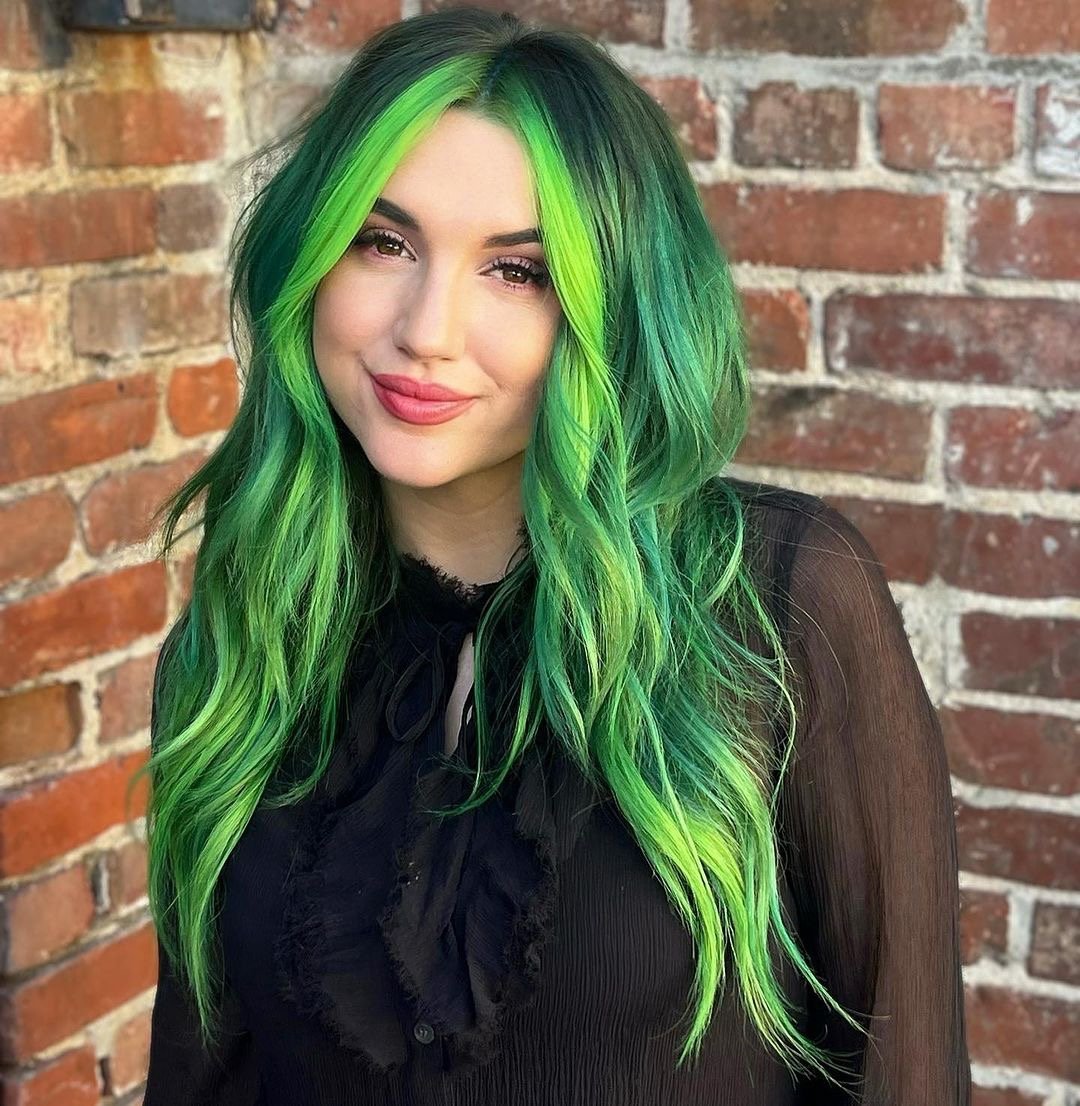 Beautiful electric green hair color on long hair.