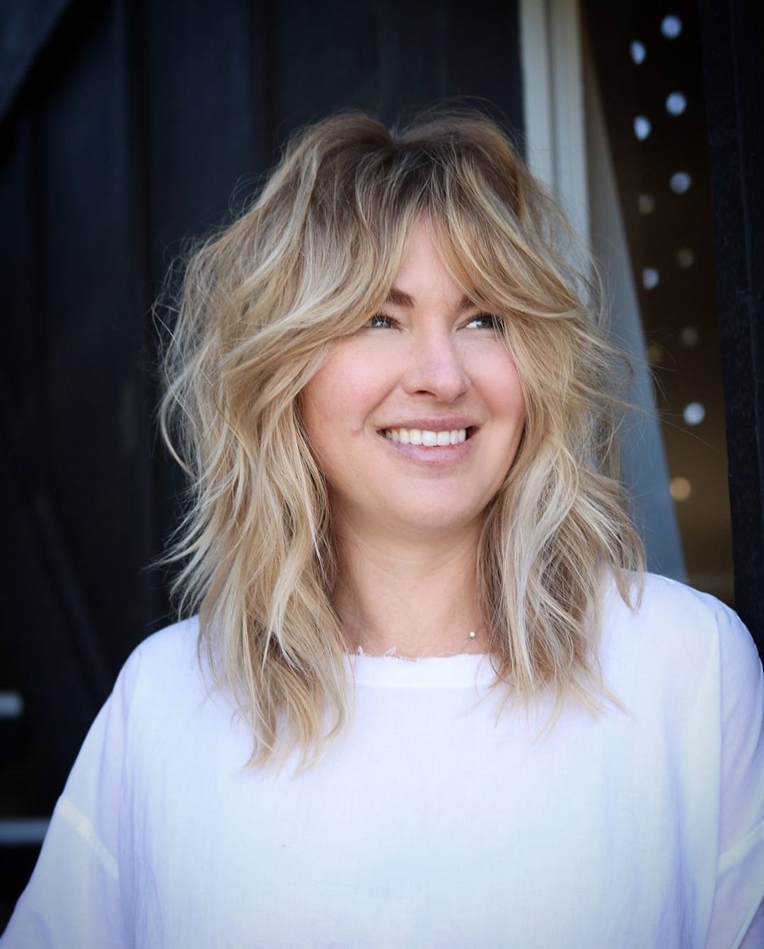 Woman with a gorgeous modern shag haircut.