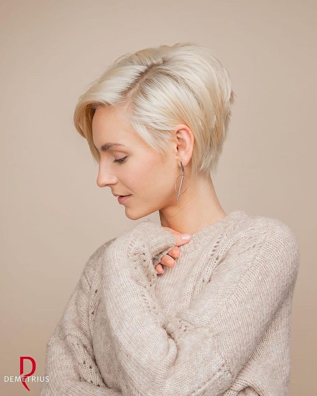 Woman with a gorgeous blonde asymmetrical haircut.