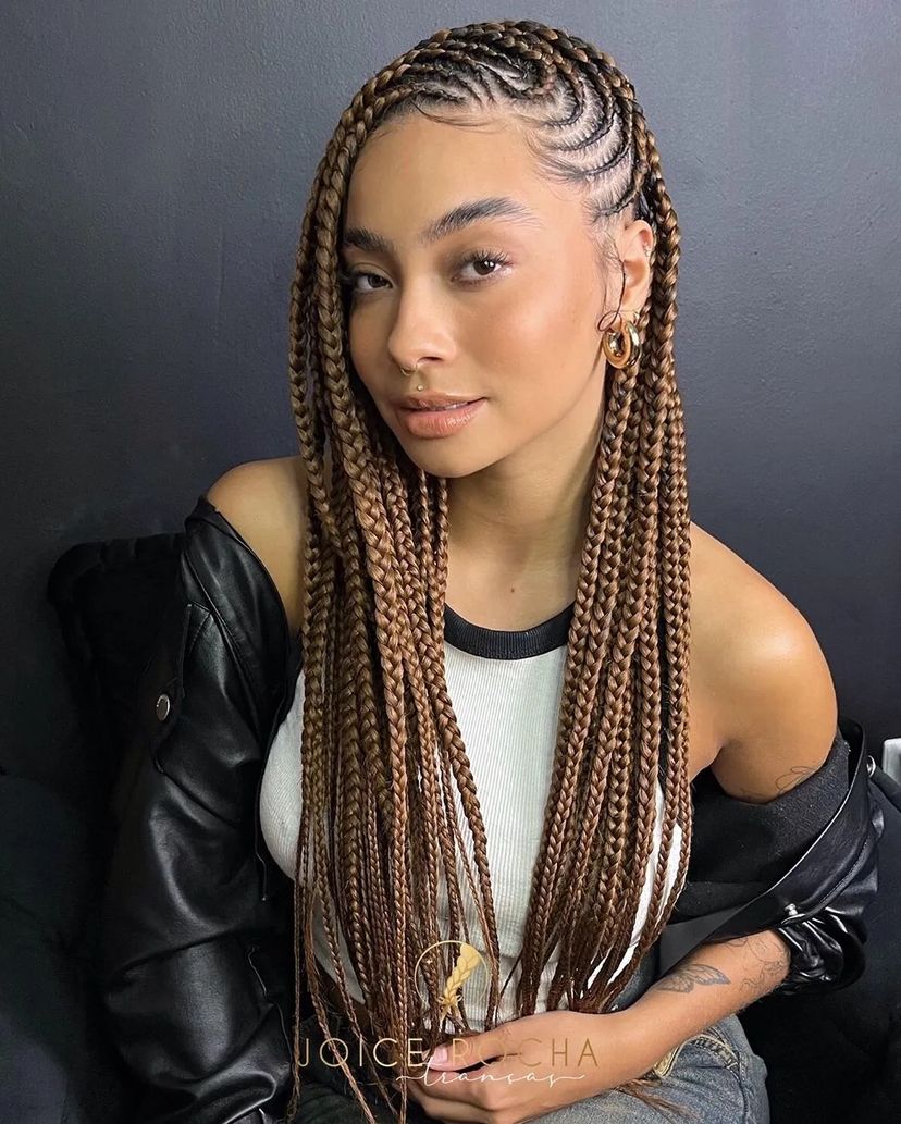 Woman with braided protective hairstyle. Find out what hairstyles are best for every hair type.