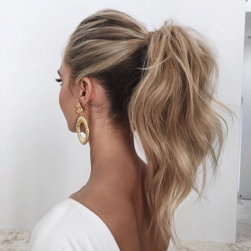 Woman with gorgeous textured high ponytail. Find out what hairstyles are best for every hair type.