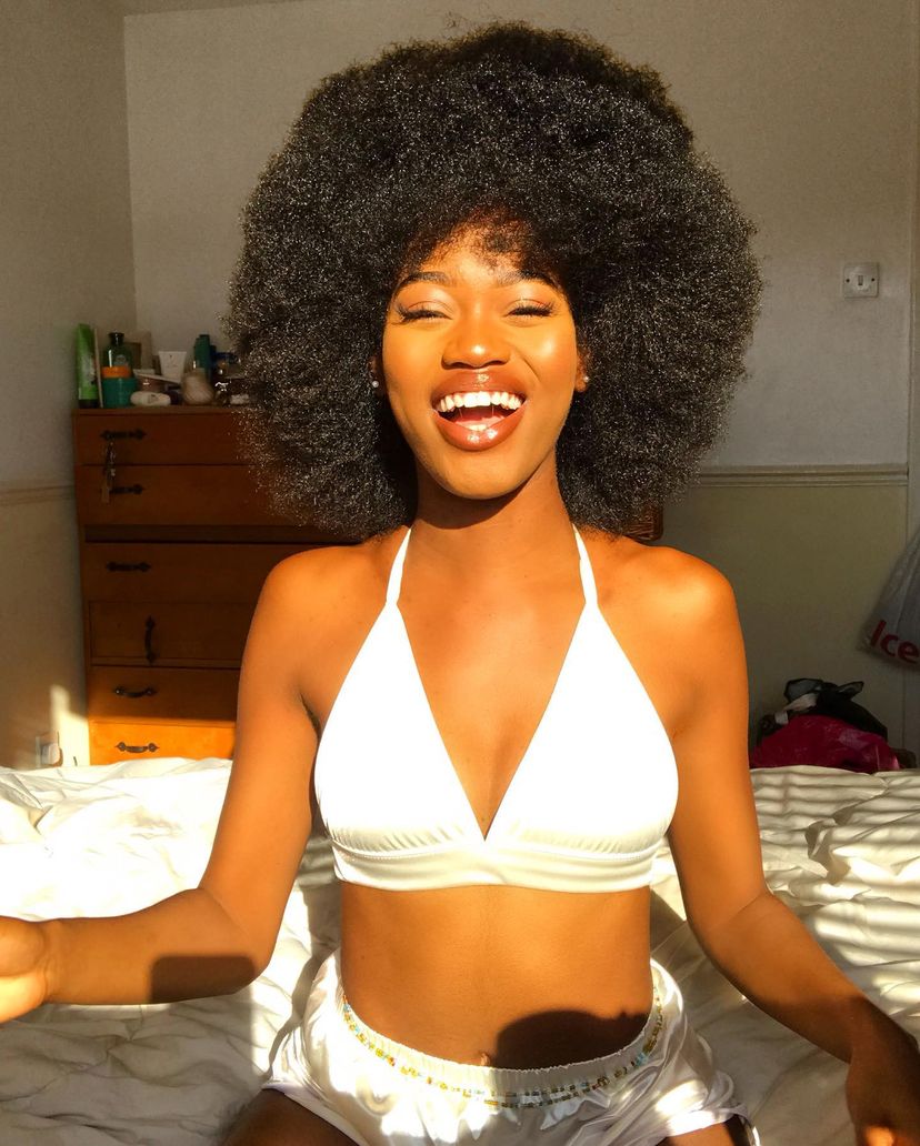 Beautiful woman with a natural afro. Find out what hairstyles are best for every hair type.