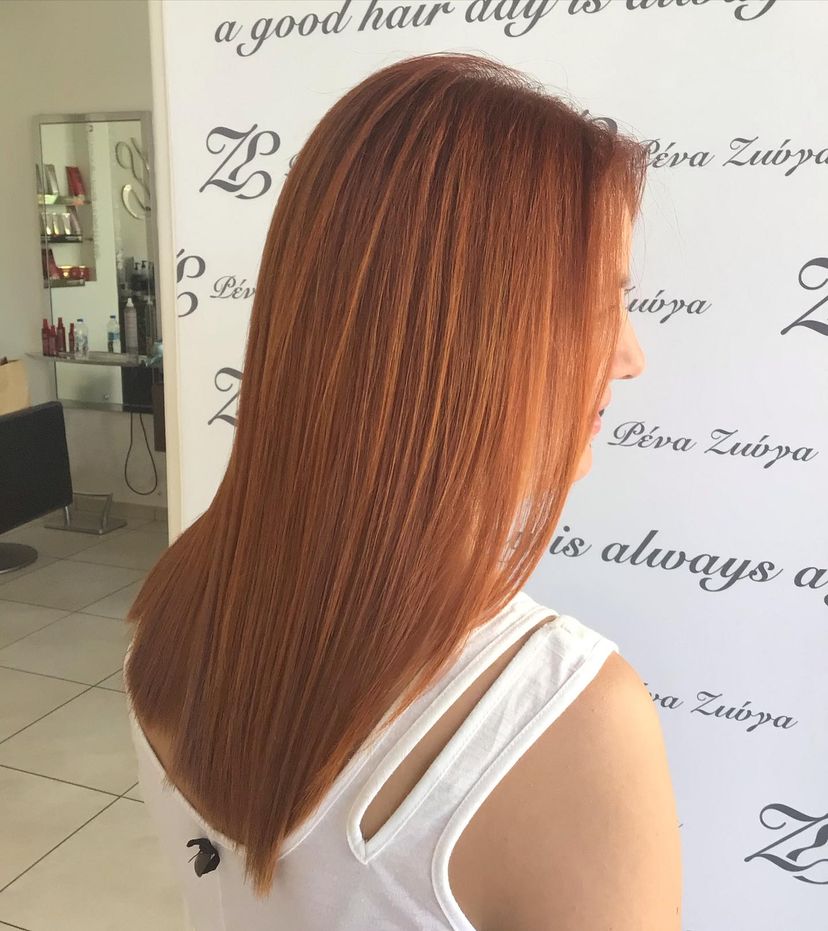 Woman with gorgeous straight red hair. Find out what hairstyles are best for every hair type.