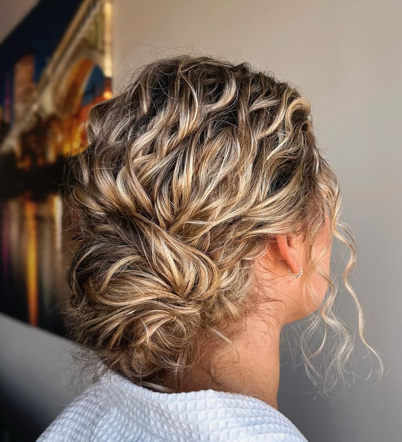 Woman with gorgeous curly updo. Find out what hairstyles are best for every hair type.