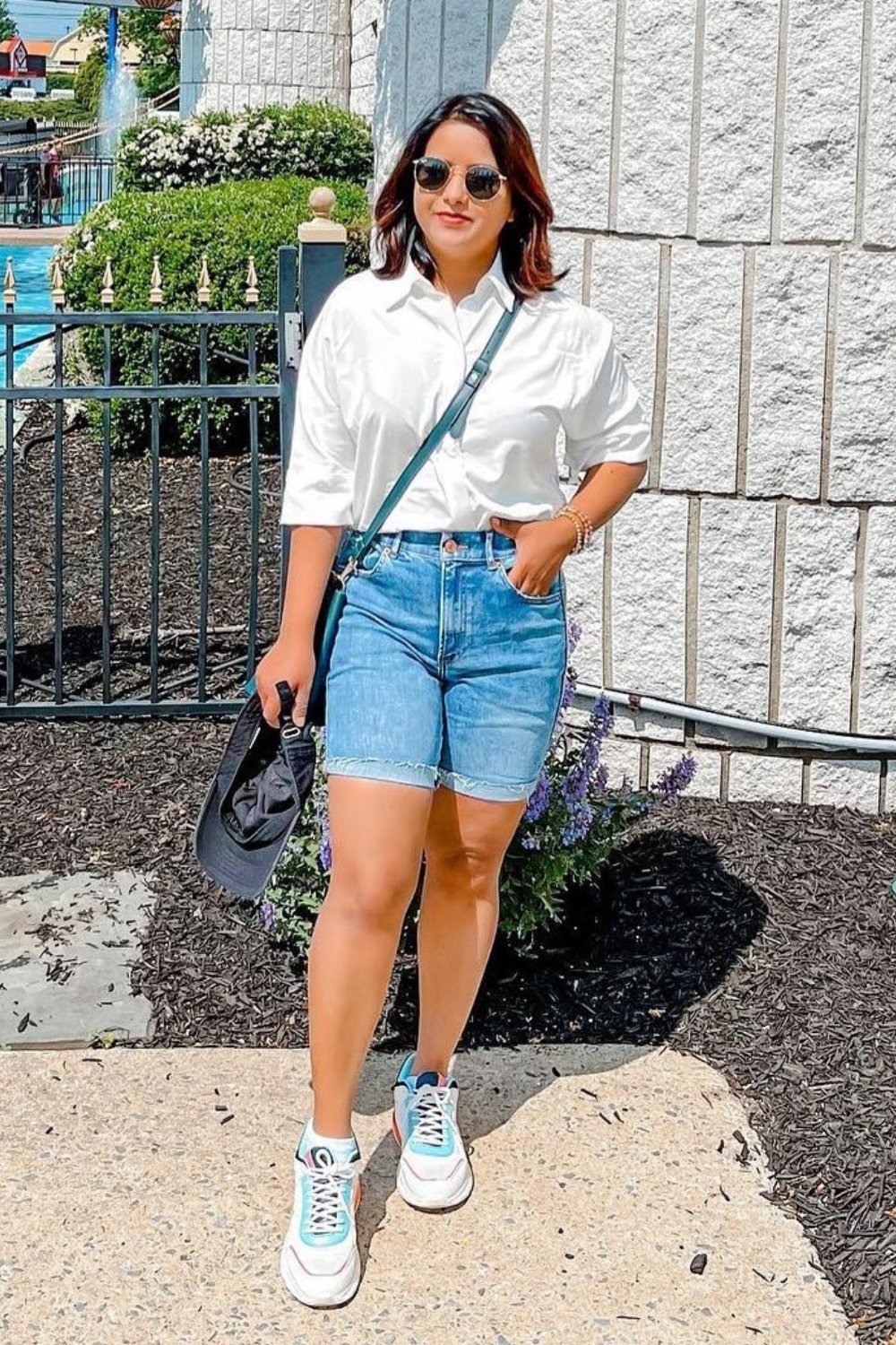 how-to-wear-a-white-button-down-shirt Denim Shorts and Sneakers