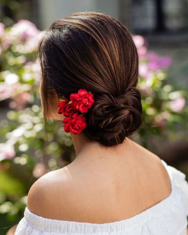 low-bun-hairstyle-with-rose Low Bun Hairstyle with Rose