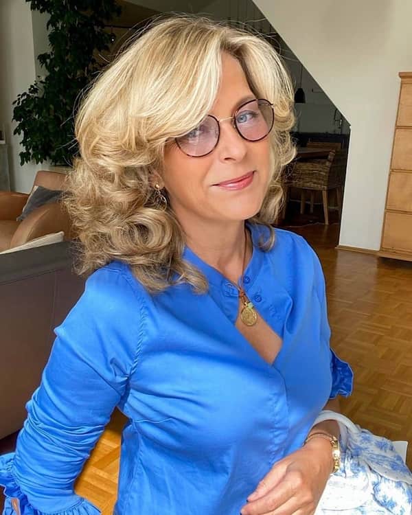 Mid-Length Haircut with Curls and Bangs