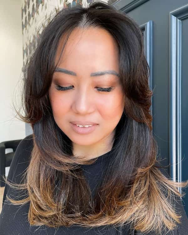 Mid-length razor Haircut with Feathered Layers