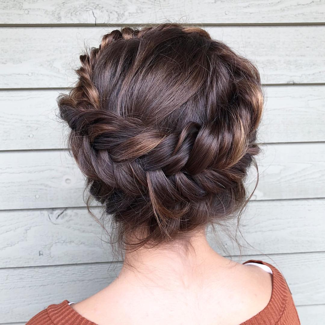 Woman with gorgeous braided crown hairstyle.