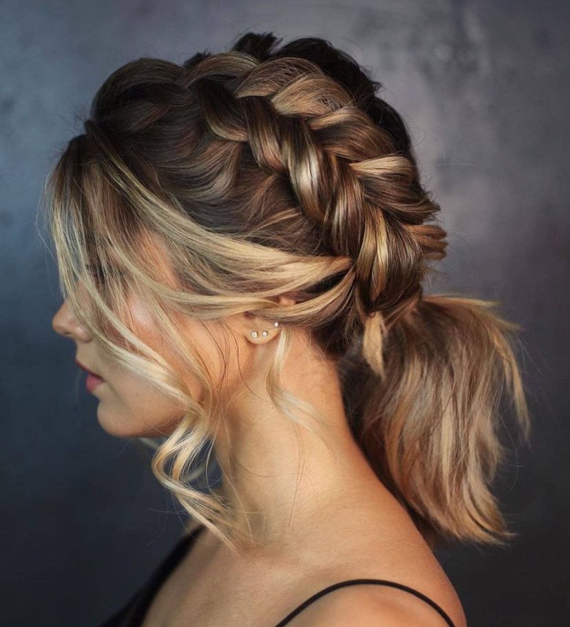 Gorgeous woman with braided ponytail hairstyle.