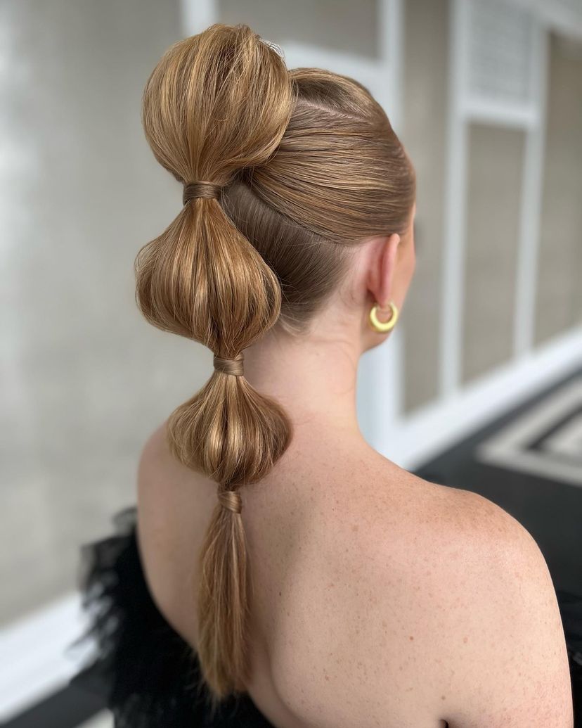 Gorgeous woman with bubble ponytail hairstyle.