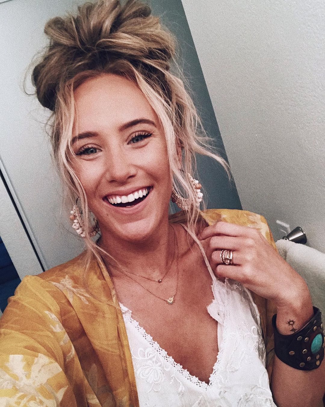 Gorgeous woman with messy bun hairstyle.