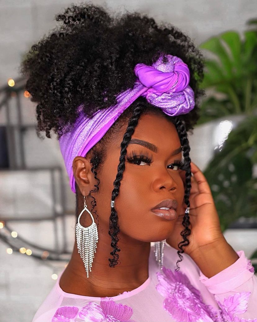 Gorgeous woman with a scarf-wrapped hairstyle.