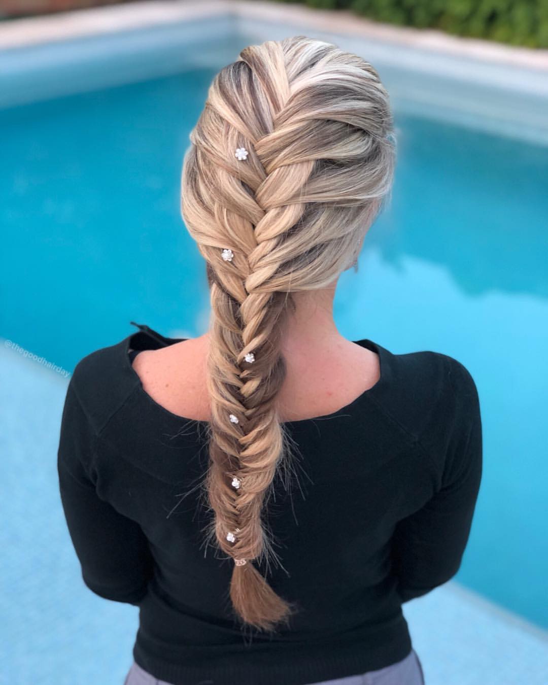 Gorgeous woman with fishtail braid hairstyle.
