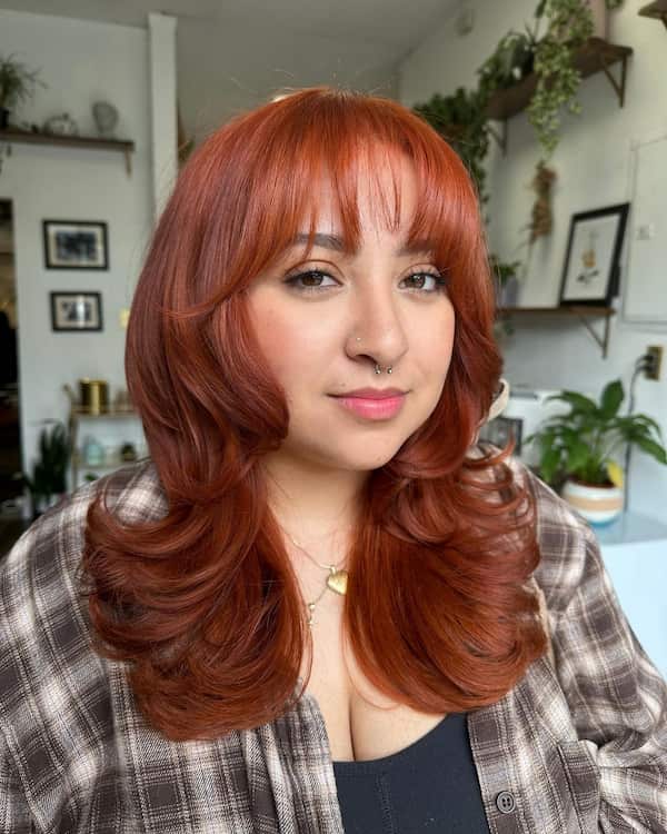 Reddish Feathered Haircut with Fringe for Round Face