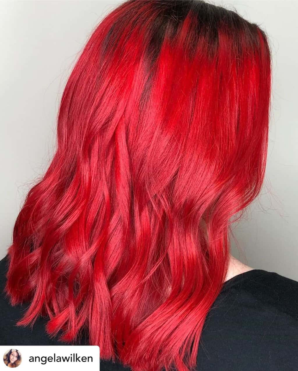 Vibrant fire engine red hair.