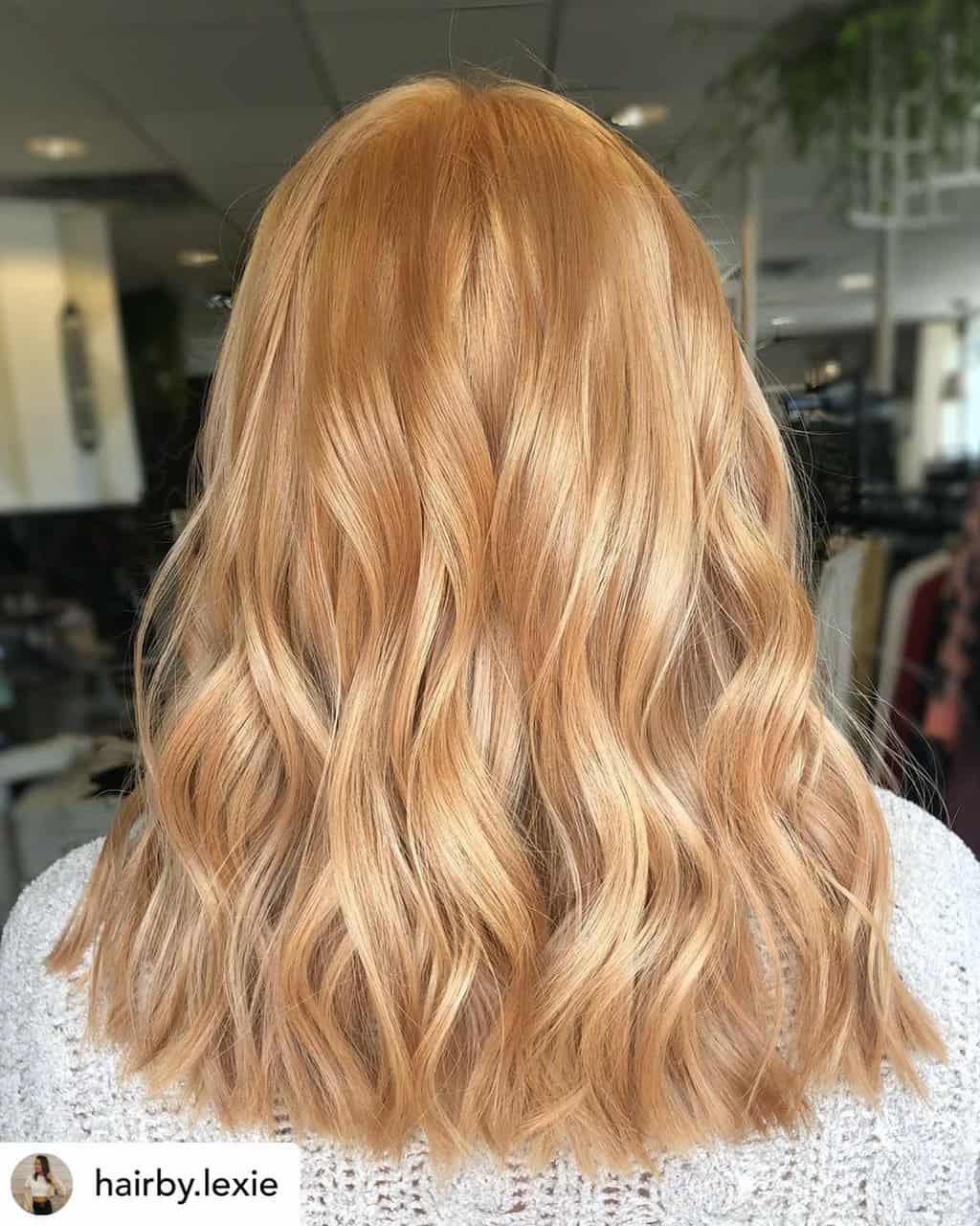 Vibrant strawberry blonde hair.