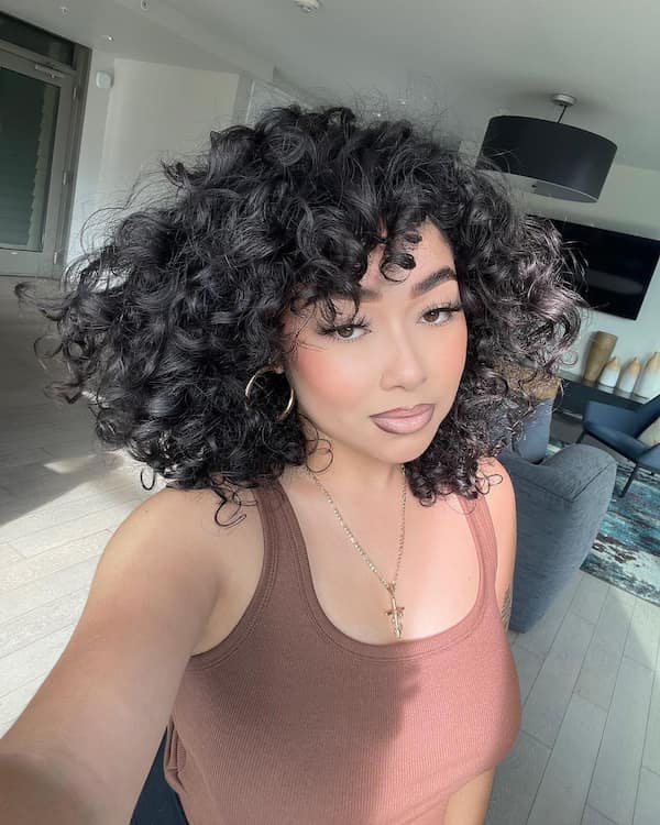 Short Hair with Bold Curls and Side Bangs