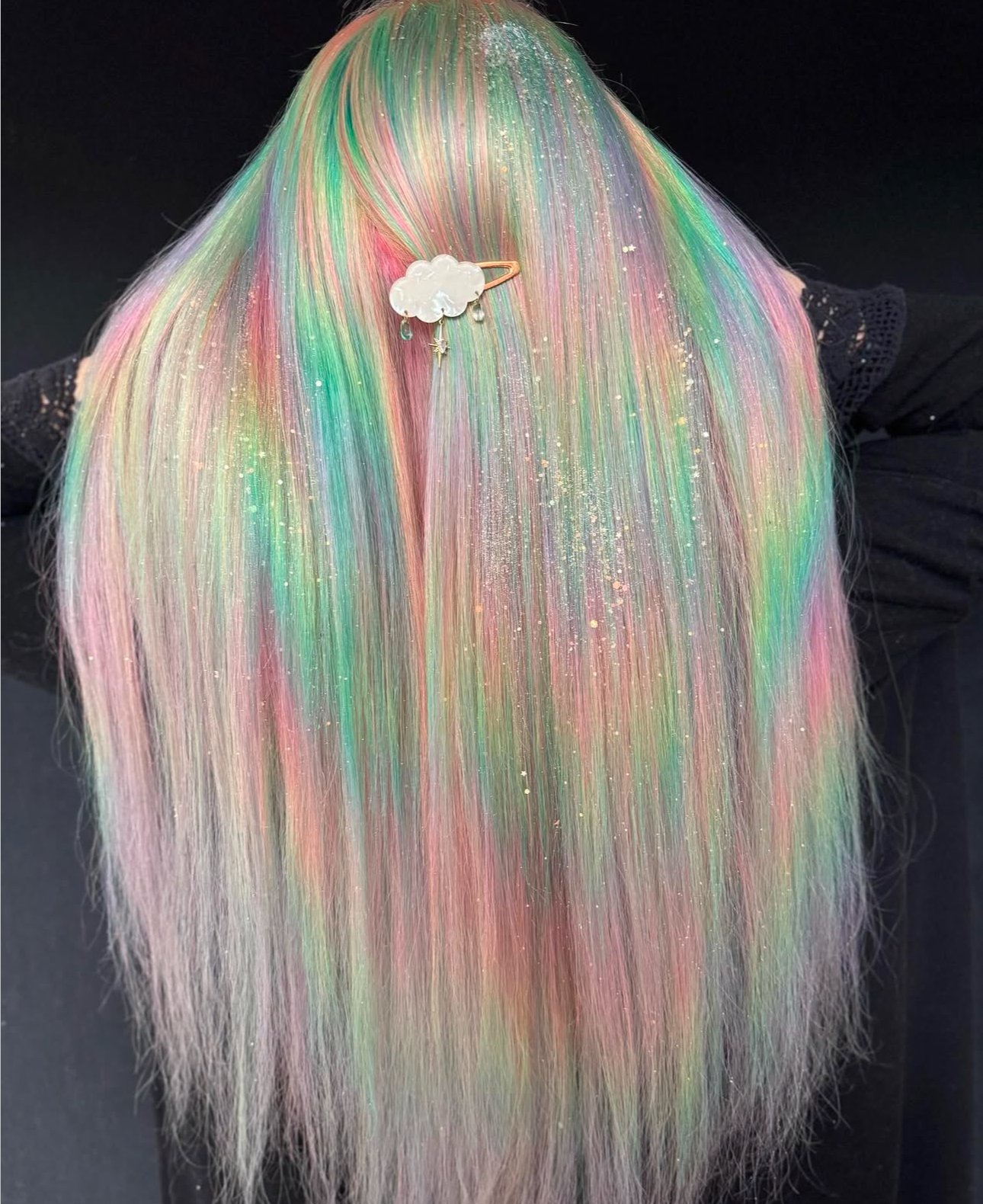 Beautiful woman with gorgeous pastel hair color on long straight hair.