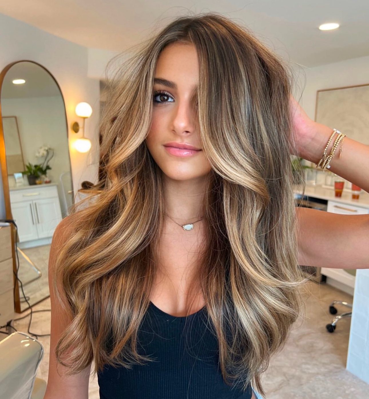 Beautiful woman with bronde balayage hair color on gorgeous long hair.