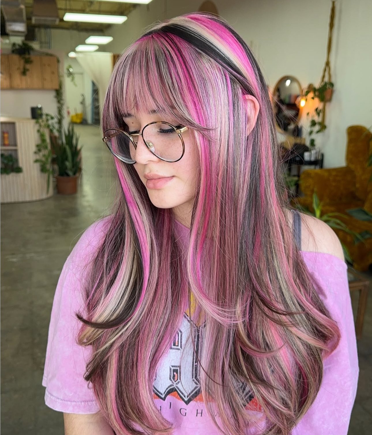 Beautiful woman with neapolitan hair color on long voluminous hair.