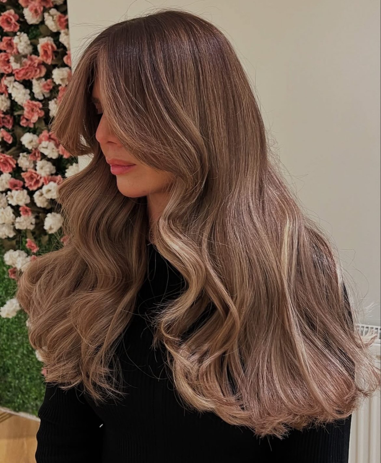 Gorgeous mocha bronde hair color on long wavy hair.