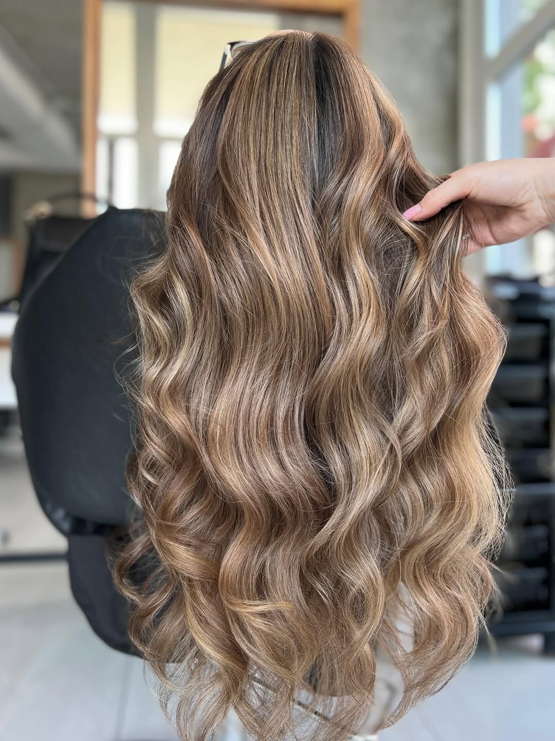 Gorgeous burnt sugar brunette hair color on long, curled hair.